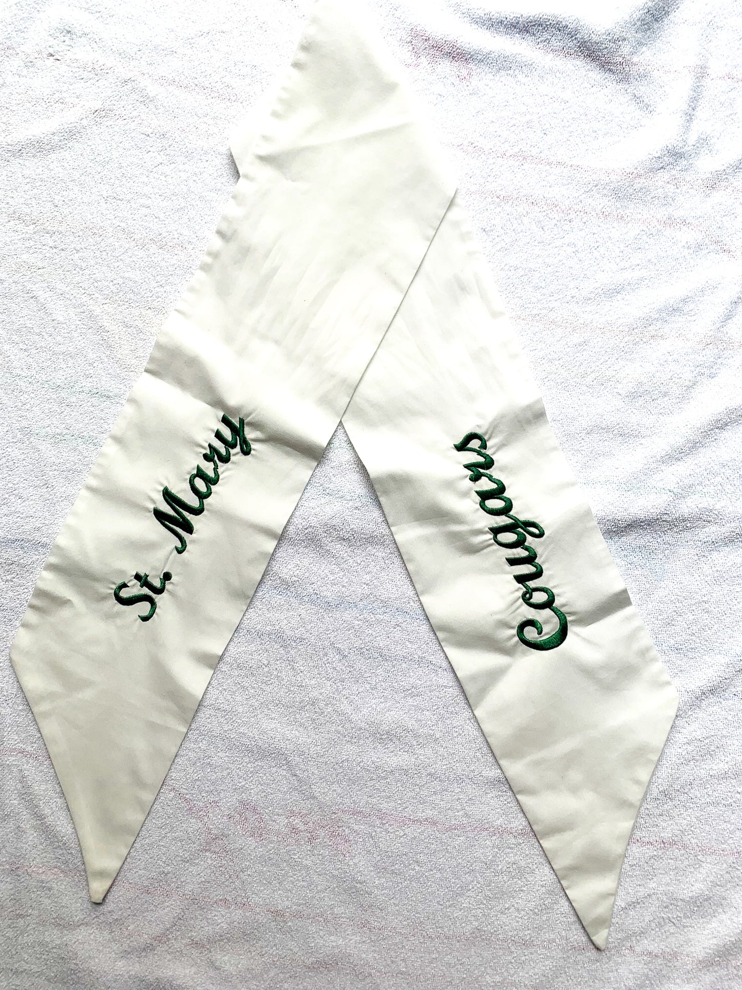 White Cotton Wreath Sash with School Name and Mascot in Green Script Font. Mascot embroidered on one side and school name embroidered on other side. Choose text color.