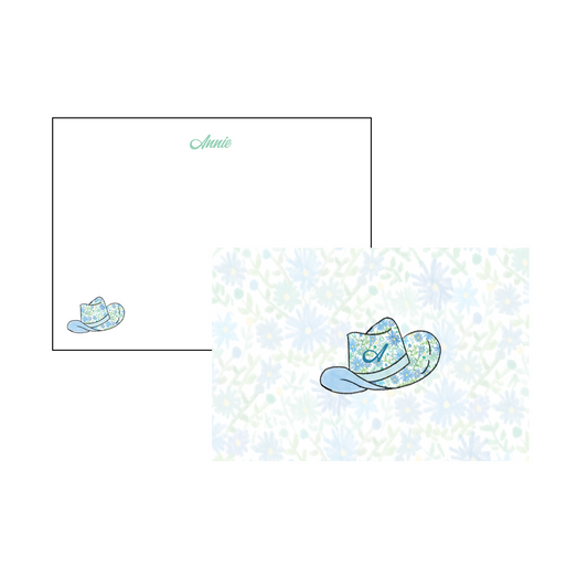 A6 Stationery Set with script font on the front in teal and blue floral cowgirl hat in the corner. Front has blue floral design in background with blue floral cowgirl hat with initial. Name and initial personalized to your liking. 