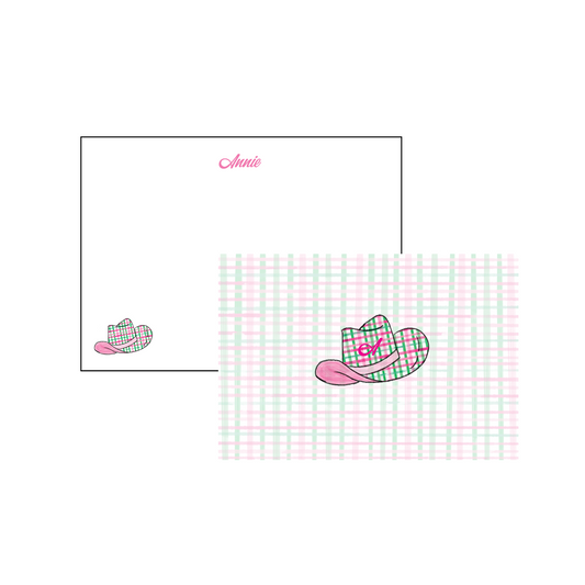 A6 stationery cards. Pink script font and pink and green plaid cowgirl hat in corned. 'Annie' written on card but can be personalized to your liking. Front of card is pink and green background with pink and green plaid cowgirl hat in middle with initial in middle of hat. 