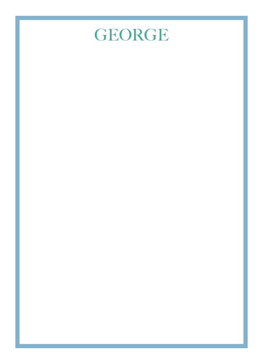 White notepad with 'GEORGE' printed at the top in a serif block font on a white background with teal and a blue border. Notepad can be personalized with name. 