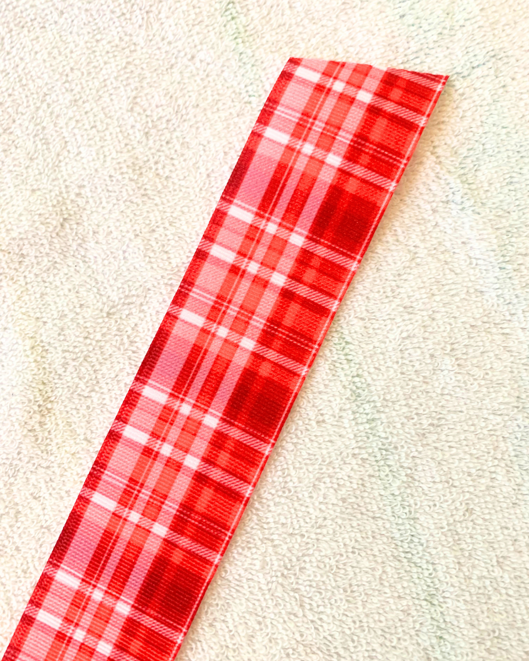 Red plaid design hair ribbon. 