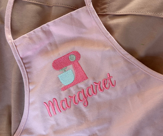 Pink with embroidered design and name 'Margaret' on a beige background