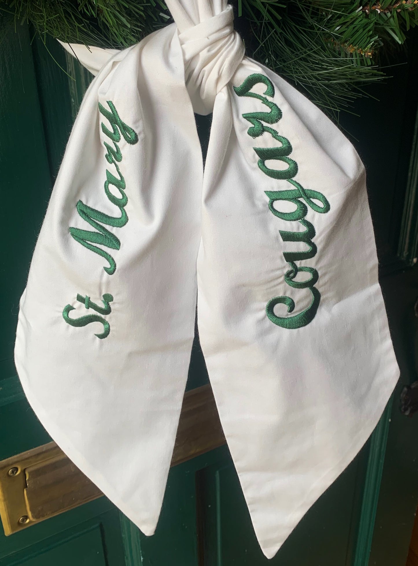 White Cotton Wreath Sash with School Name and Mascot in Green Script Font. Mascot embroidered on one side and school name embroidered on other side.  Choose text color. 