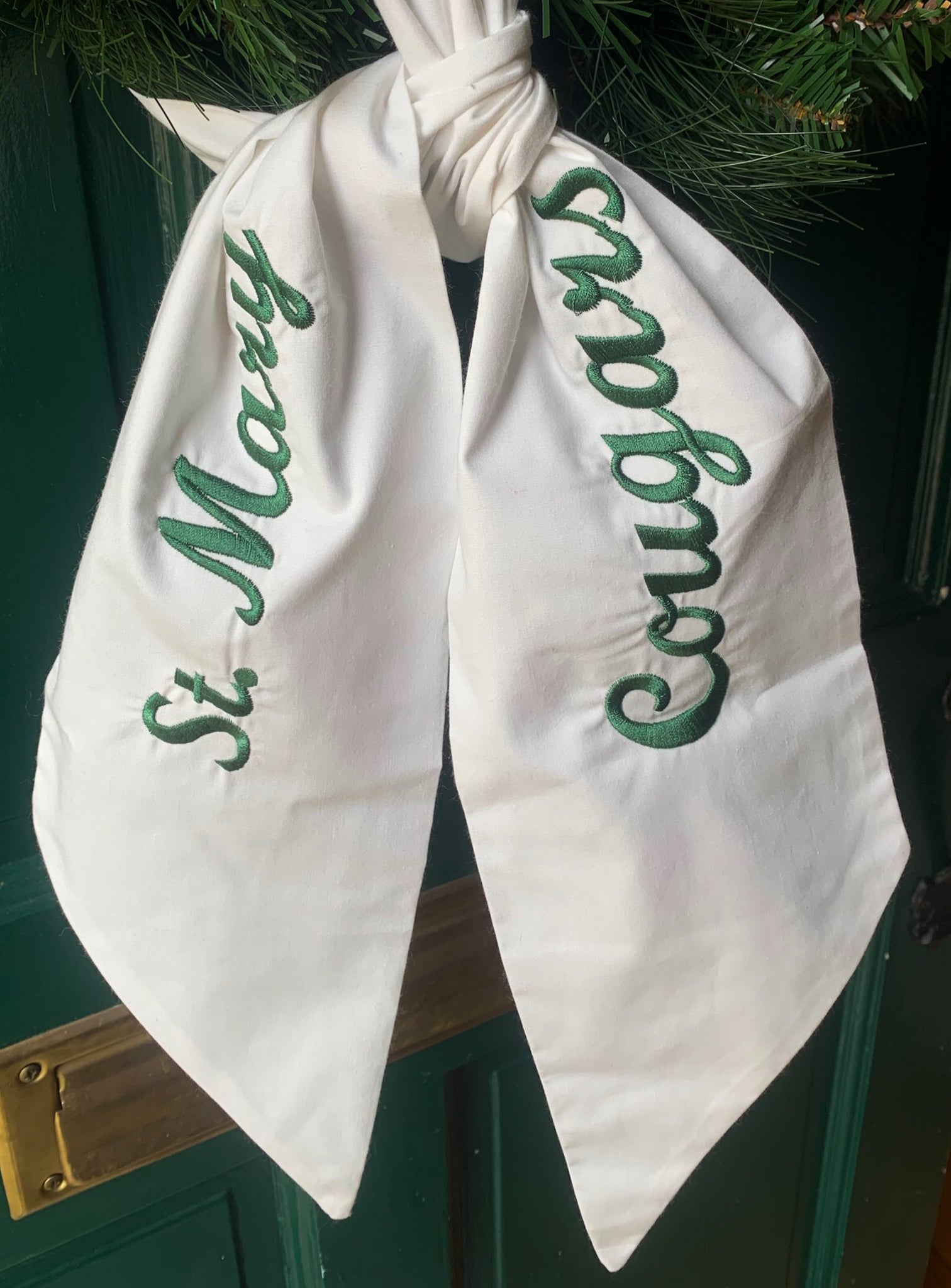 White Cotton Wreath Sash with School Name and Mascot in Green Script Font. Mascot embroidered on one side and school name embroidered on other side.  Choose text color. 